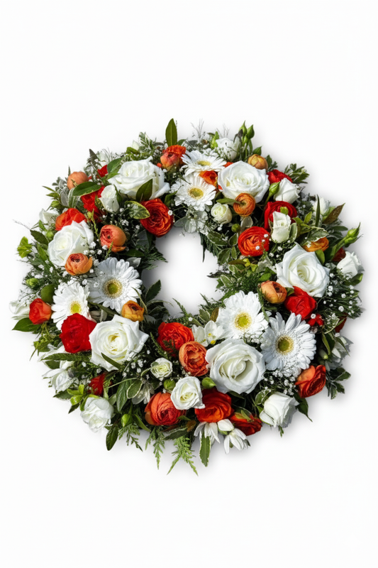 Floral wreath with red, white, and orange flowers on a white background