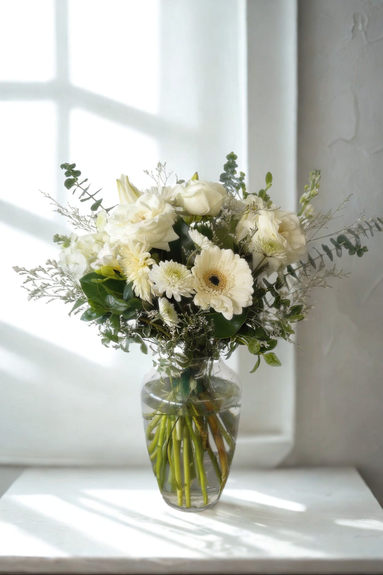 white and green in a vase