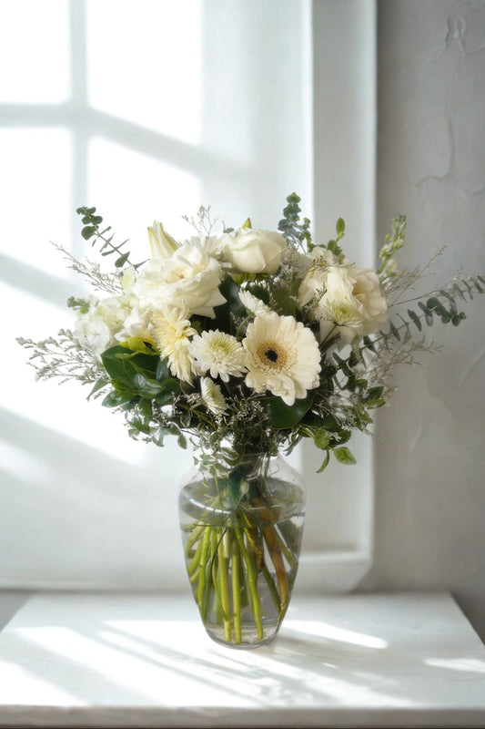 white and green in a vase