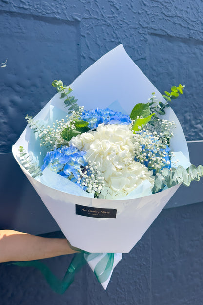 Blue & White Hydrangea Bouquet wrapped with a white paper