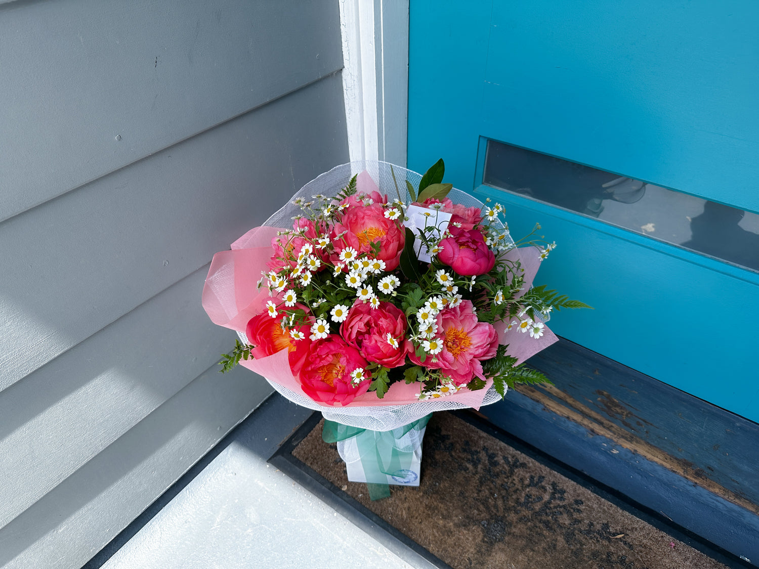 Peony bouquet in front of your door