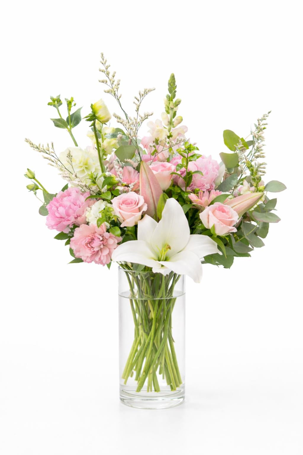 Bouquet of flowers in a clear vase on a white background