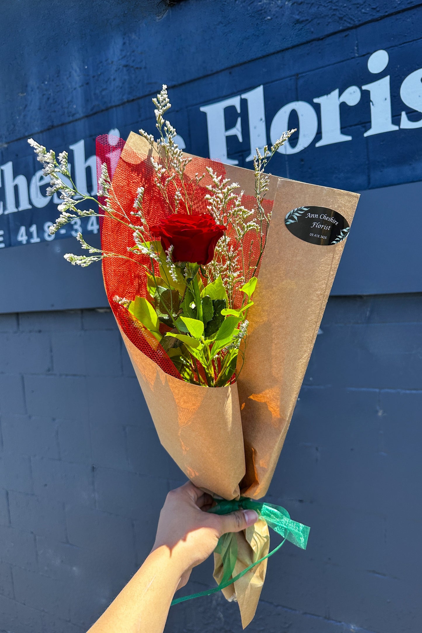 Single Rose wrapped with a brown kraft paper