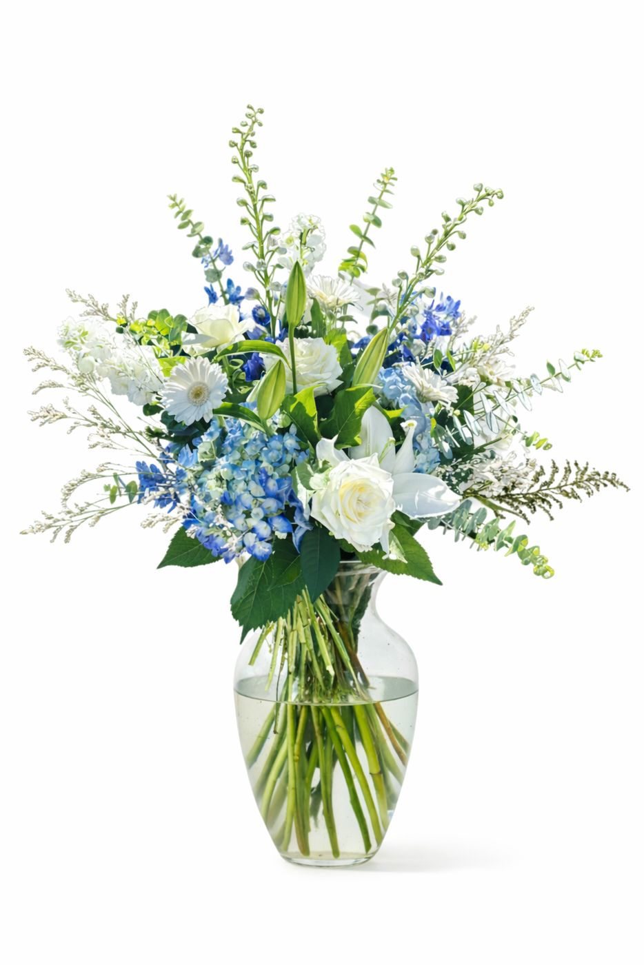 Bouquet of flowers in a clear vase on a white background