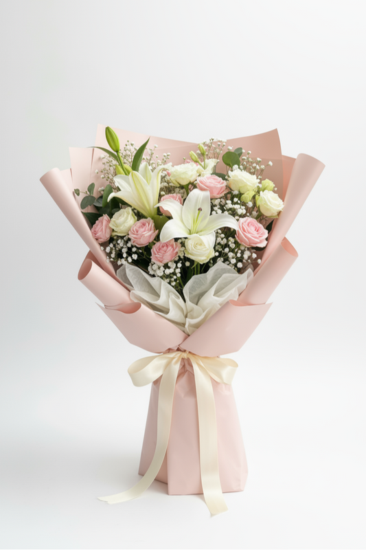 Bouquet of flowers wrapped in pink paper with a yellow ribbon on a white background